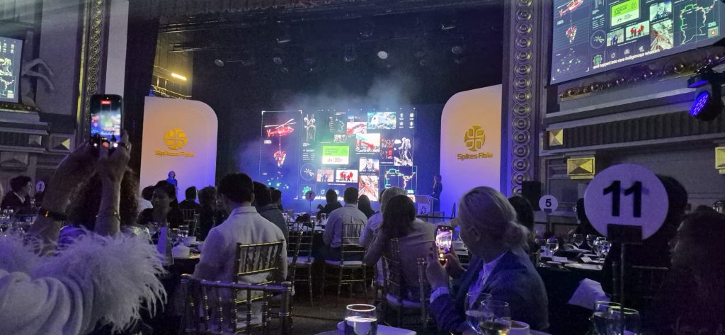 An awards stage at Spikes Asia 2026 showing a "Grand Prix" win for the "Vaseline Verified" campaign by Ogilvy Singapore in the Healthcare and Creative Commerce categories